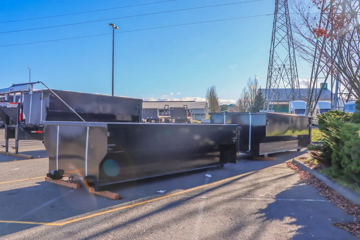 Roll-off dumpster ready for waste disposal at job site for Concrete Dumpster Rental in East Granby